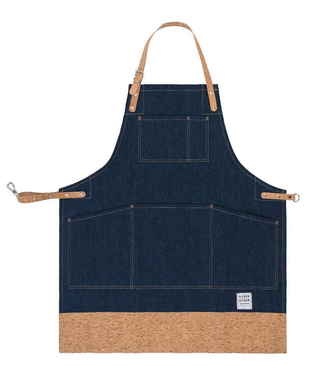 Blue denim apron with brown accents on a white background