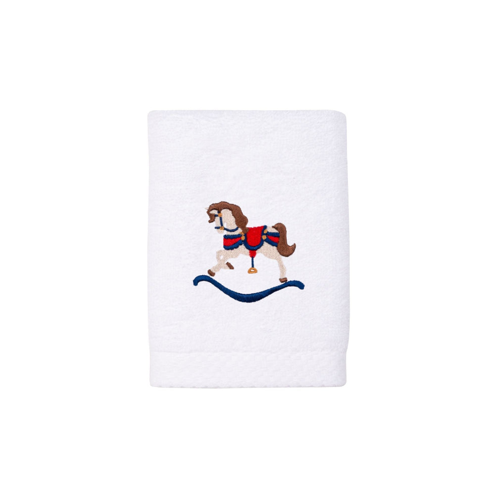 White towel with embroidered rocking horse design red and blue on a white background perfect for christmas bathrooms