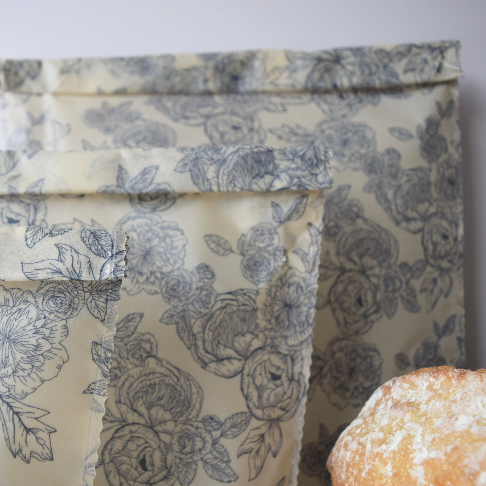 Floral-patterned beeswax bags various sizes with a close-up of a pastry.