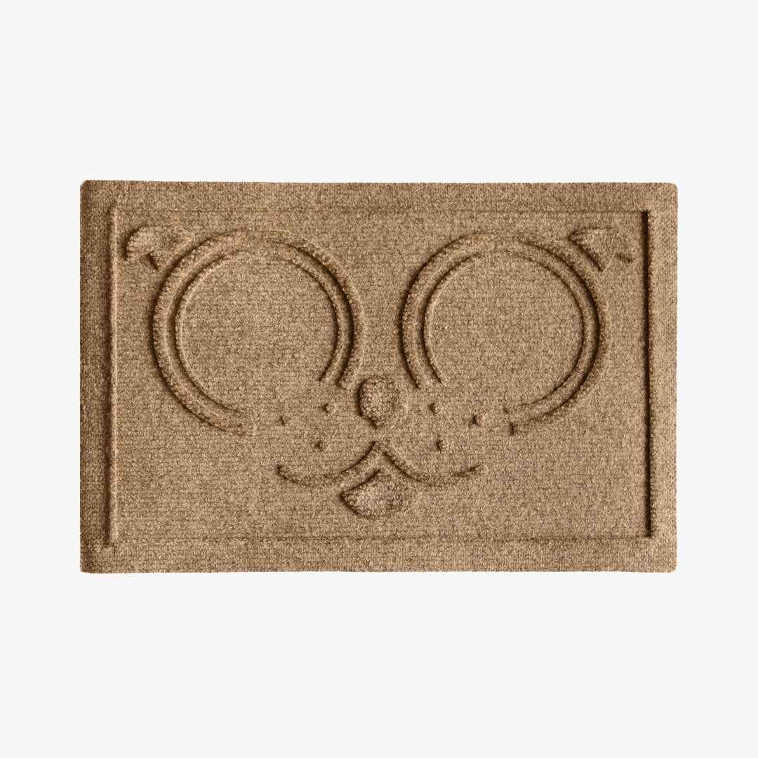 WaterHog Puppy Face Bowl Mat in Camel featuring a raised dog face design with two circular feeding areas and an outer border.