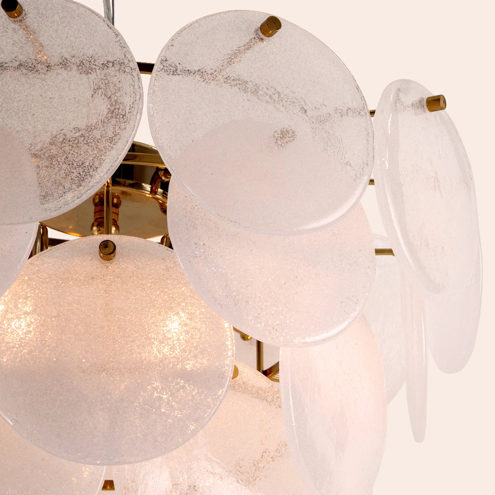 White and brass chandelier with layered glass shades