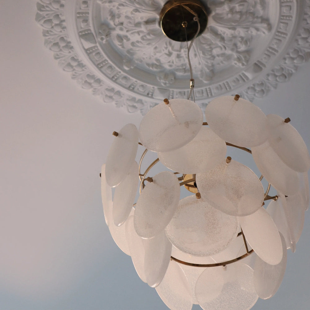 White glass chandelier showing brass ceiling rose and clear cable