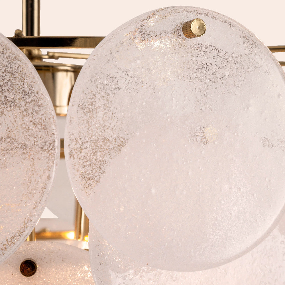 Close-up of a modern ceiling light fixture with glass shades.