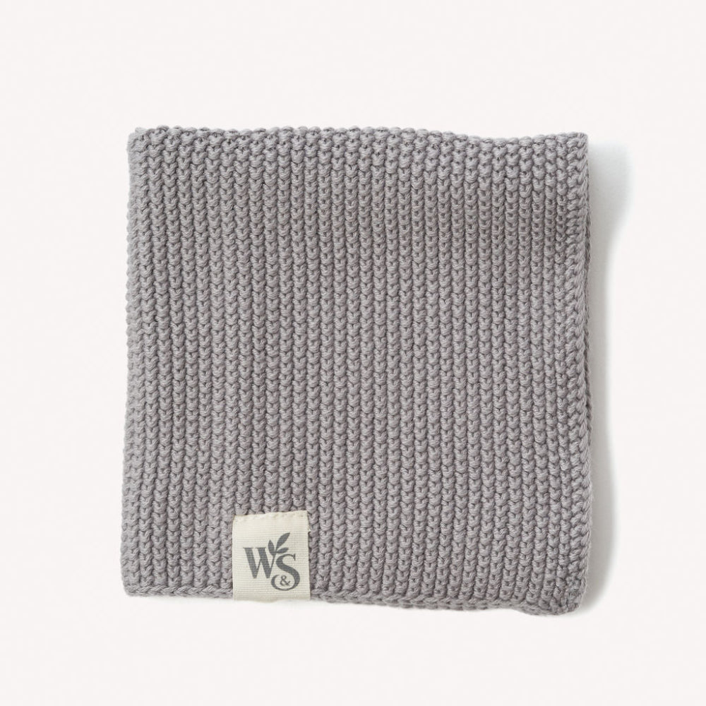 Dove Grey knitted organic dishcloth with a logo on a white background