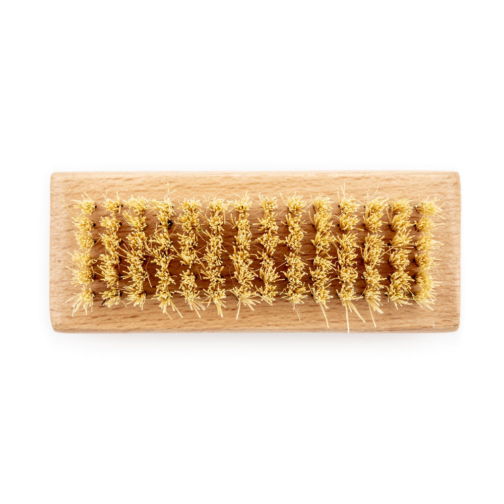 Wooden brush with natural bristles on a white background