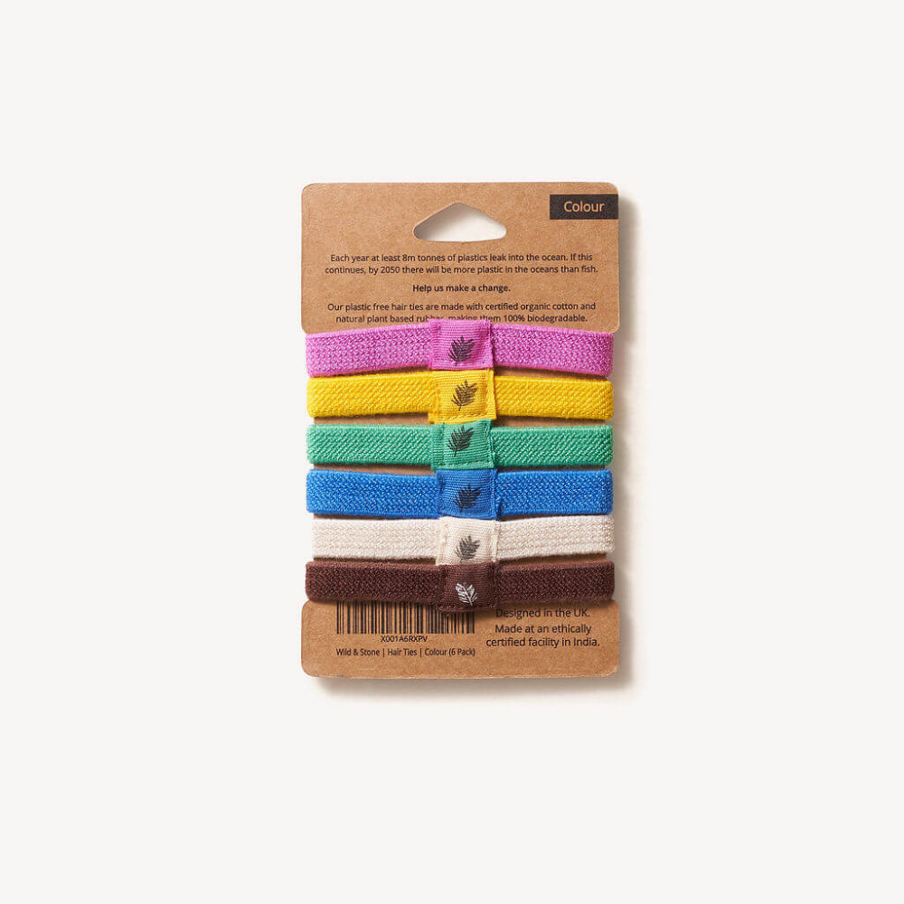 Set of colourful hairbands on a cardboard packaging with a white background