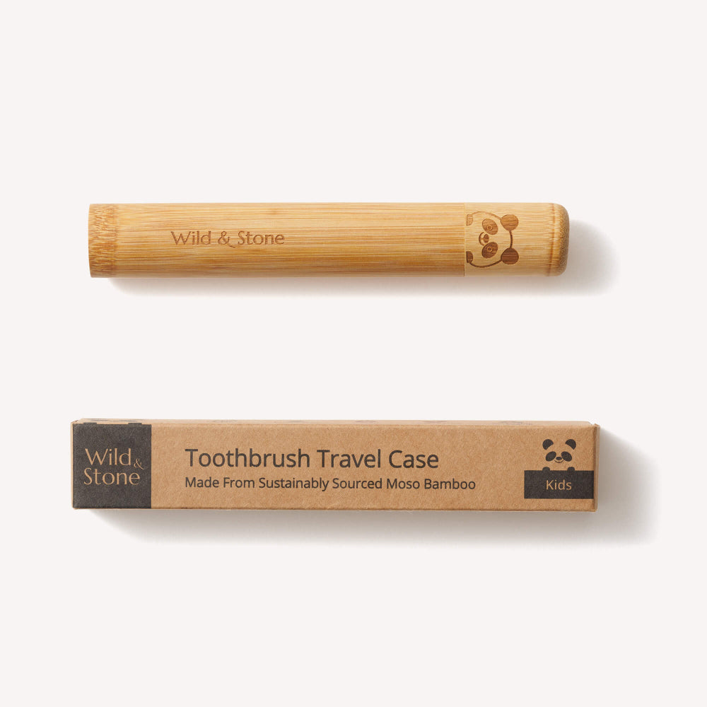 Bamboo toothbrush and travel case with 'Wild & Stone' branding on a white background