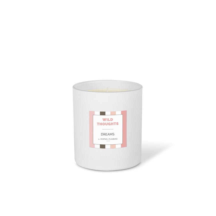 White candle with a label on a white background