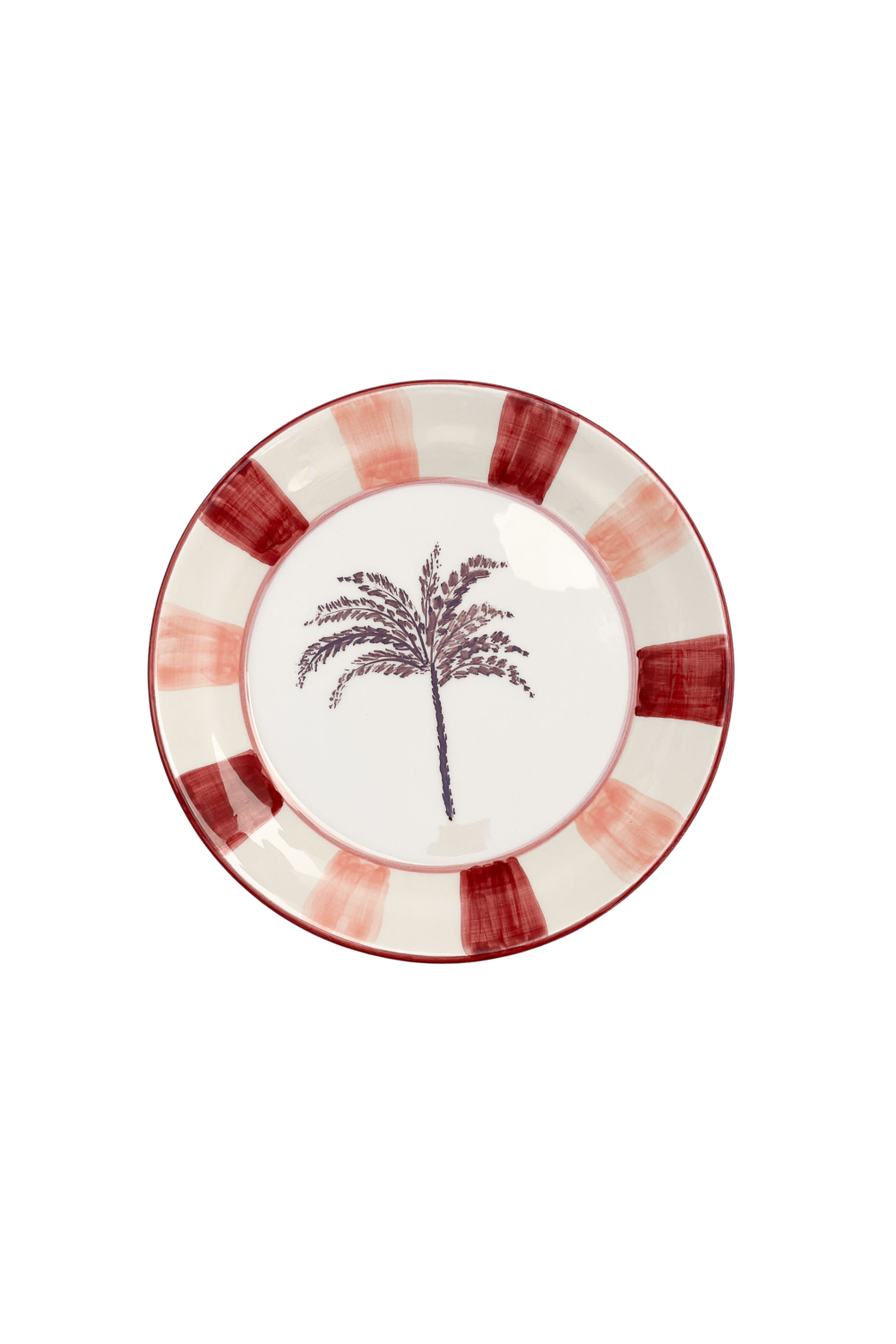 Close-up of the hand-painted palm design on a Woven Rosa ceramic serving plate