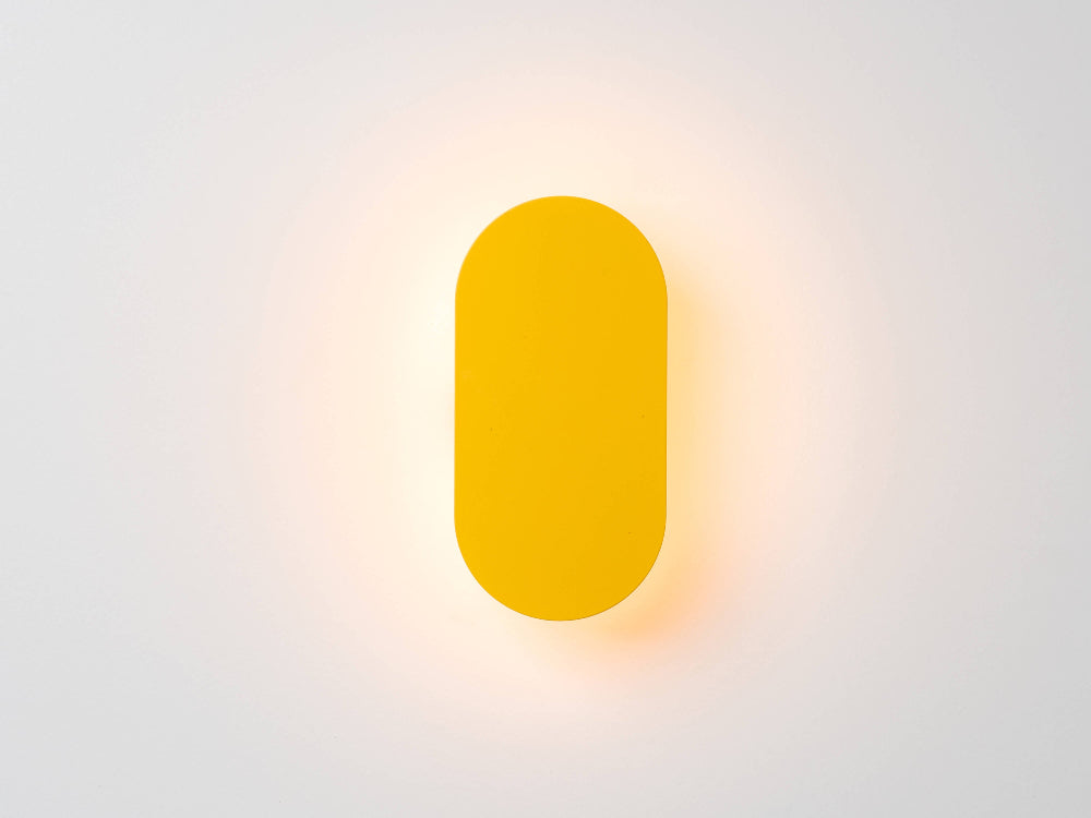 Front view of yellow mini diffuser wall light